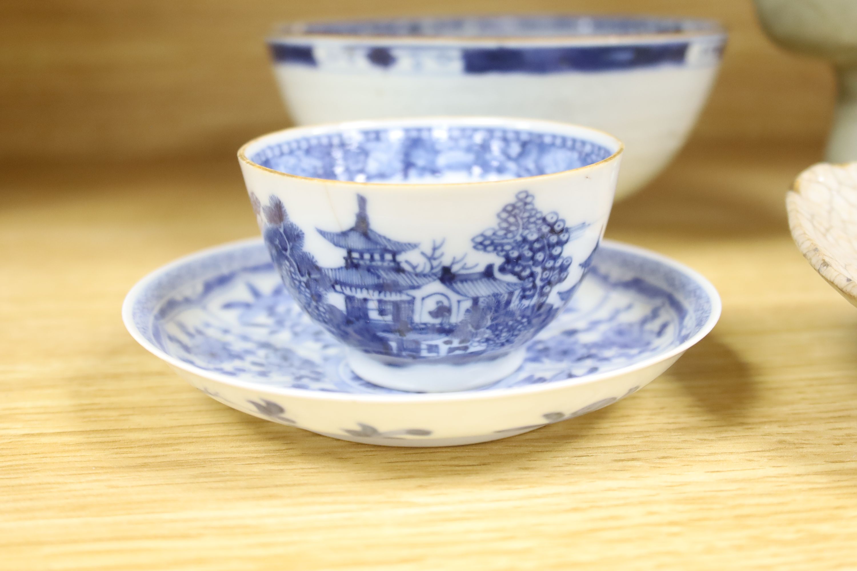 A Chinese blue and white bowl, diameter 15cm, a tea bowl and saucer, a crackleglaze shell dish and a celadon glazed stem cup